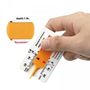 Gauge for measuring the tread height